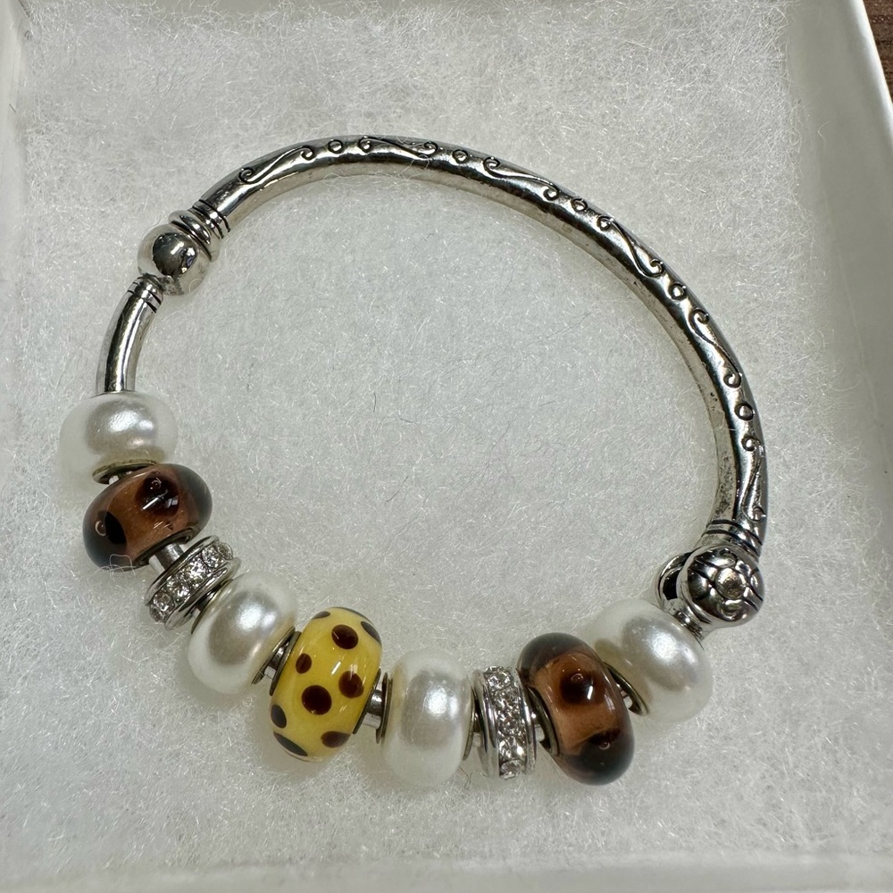 Brighton Silver Bangle Bracelet with Charms. Includes
9 charms ✨✨✨
